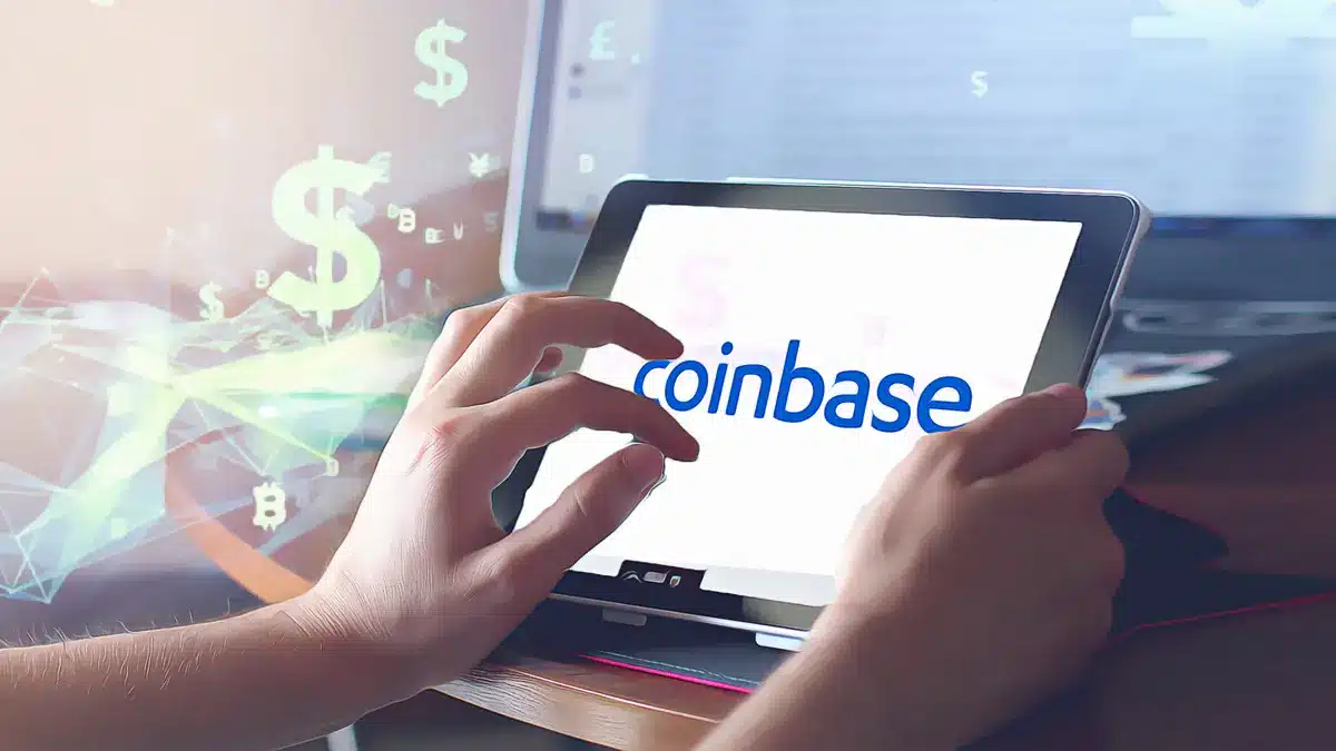 Person accessing Coinbase on a tablet with financial graphics in the background.