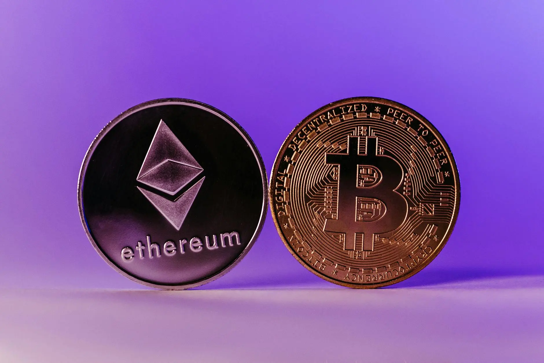 Bitcoin and Ethereum coins on a gradient purple background.