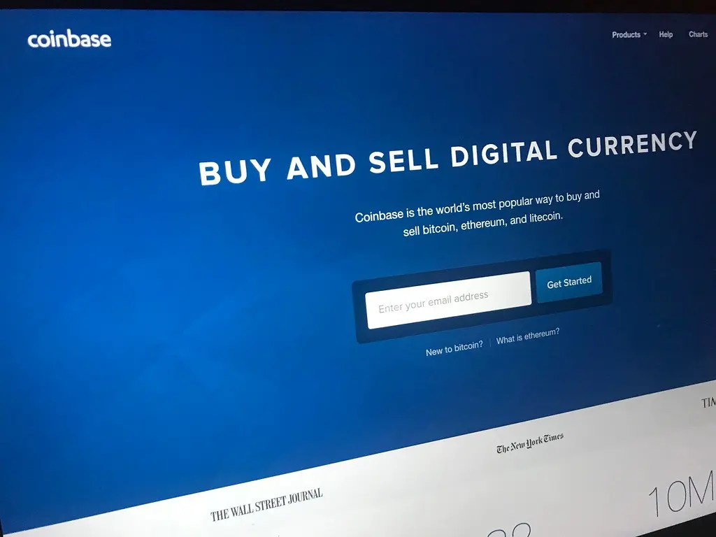 Screenshot der Coinbase-Startseite mit dem Text „Buy and sell digital currency“.