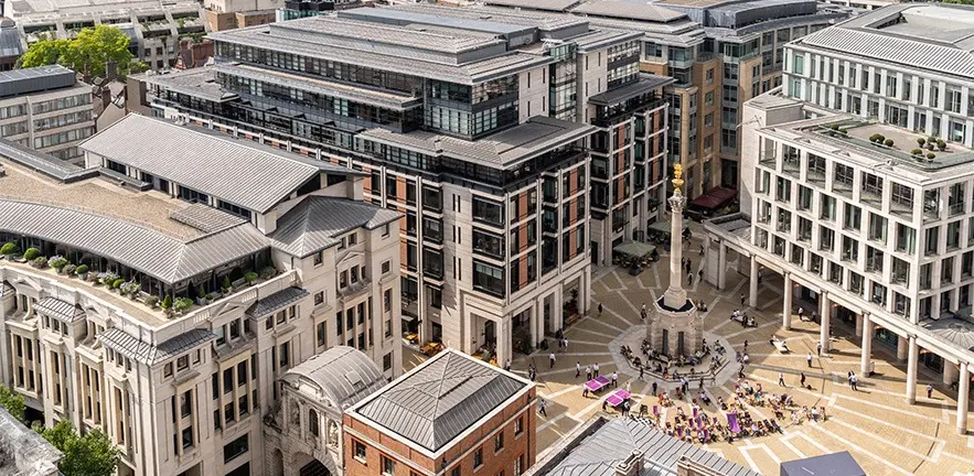 High-angle view of the London Stock Exchange building and Paternoster Square with its central monument.