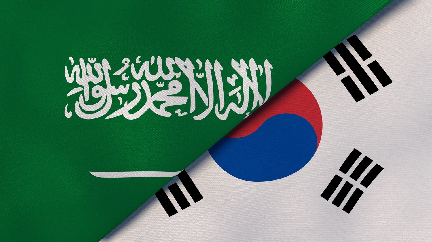The flags of Saudi Arabia and South Korea.