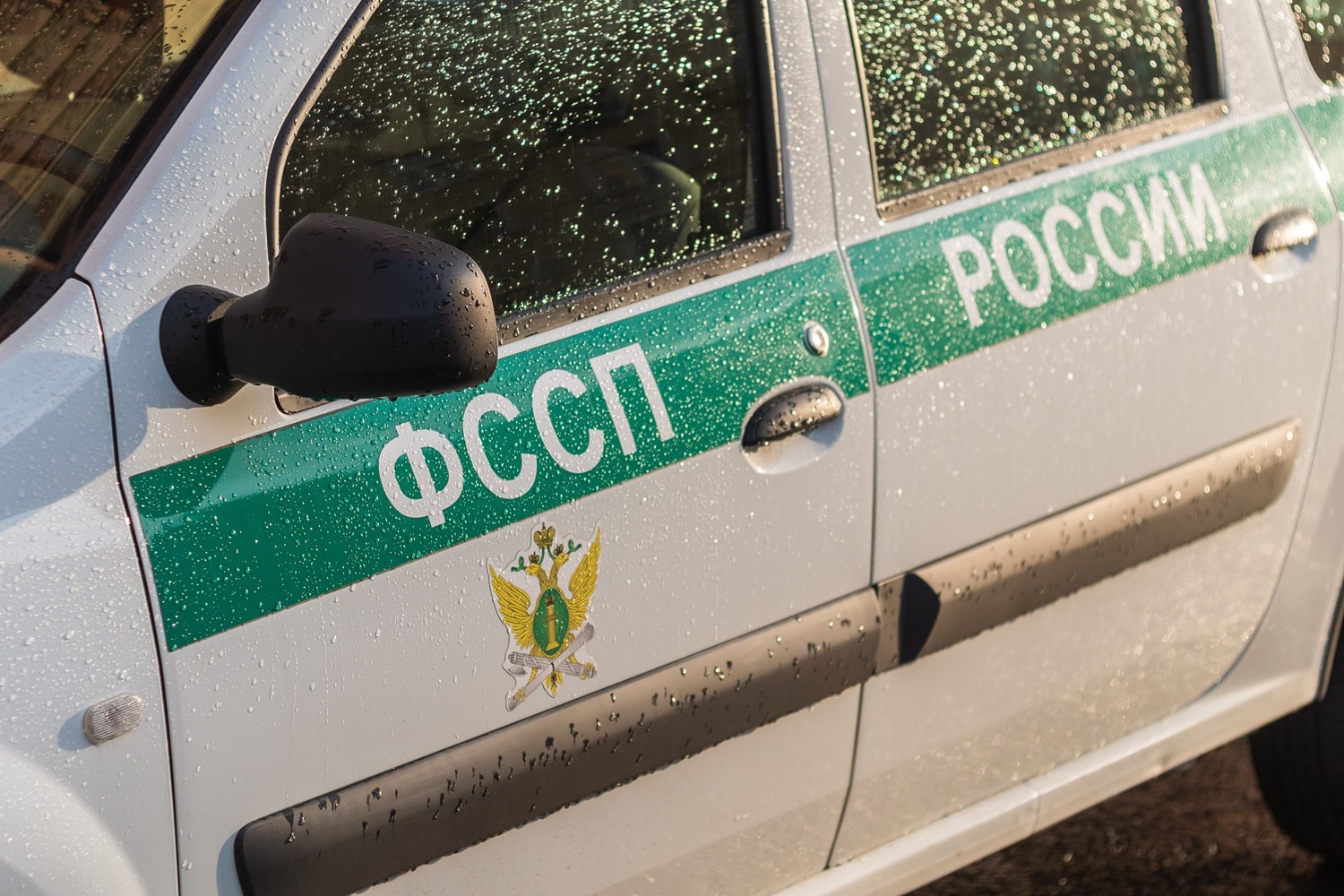 The side of a car belonging to the Russian Federal Bailiffs Service (FSSP).