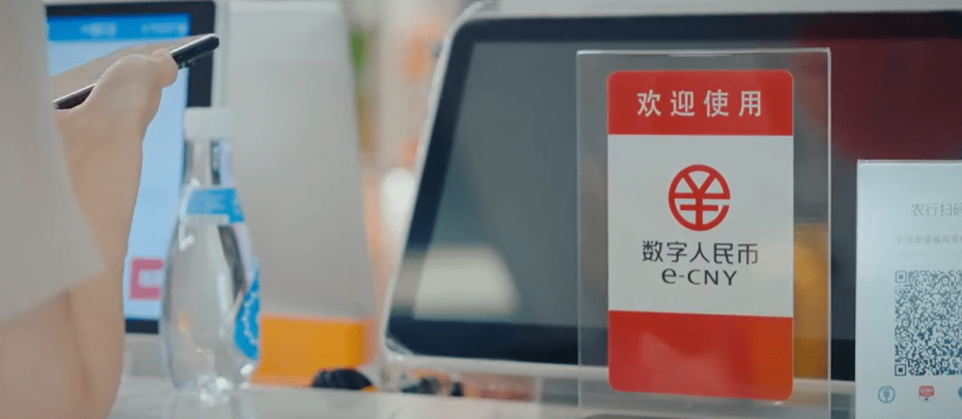 A customer uses the digital yuan to pay in a store via her smartphone.