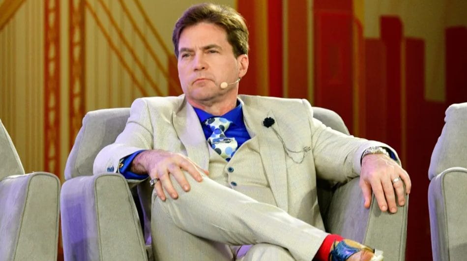 craig wright, rumoured bitcoin creator, sitting on a beige sofa