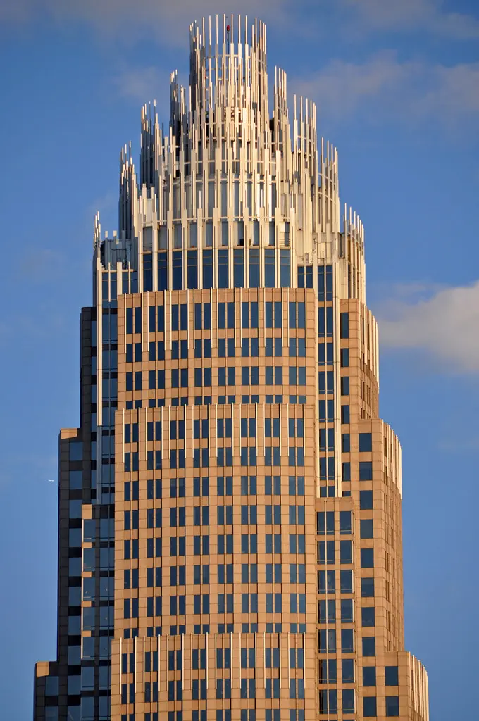 The Bank of America Corporate Center skyscraper in Charlotte, North Carolina, against a blue sky.