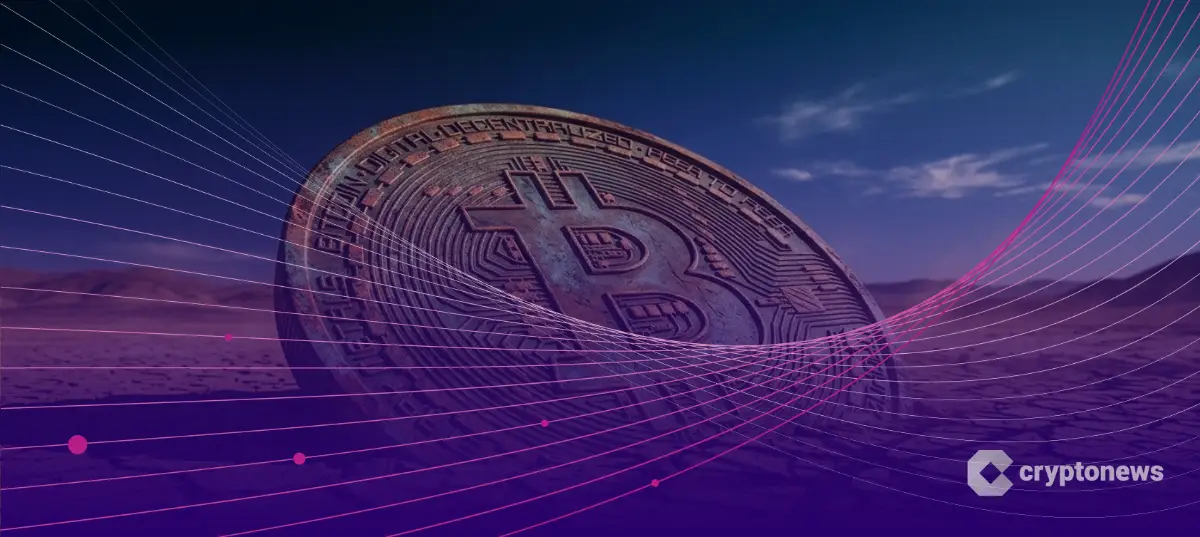 取引量減少の停滞感を象徴する、ひび割れた大地に横たわる巨大なビットコイン