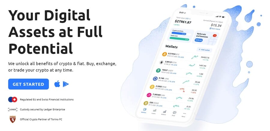 هاتف محمول يعرض تطبيق محفظة YouHodler وفيه أسعار العملات الرقمية وإلى جانبه زر البدء وبيانات أخرى